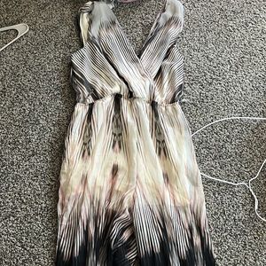 pink, white, grey and black pant romper.